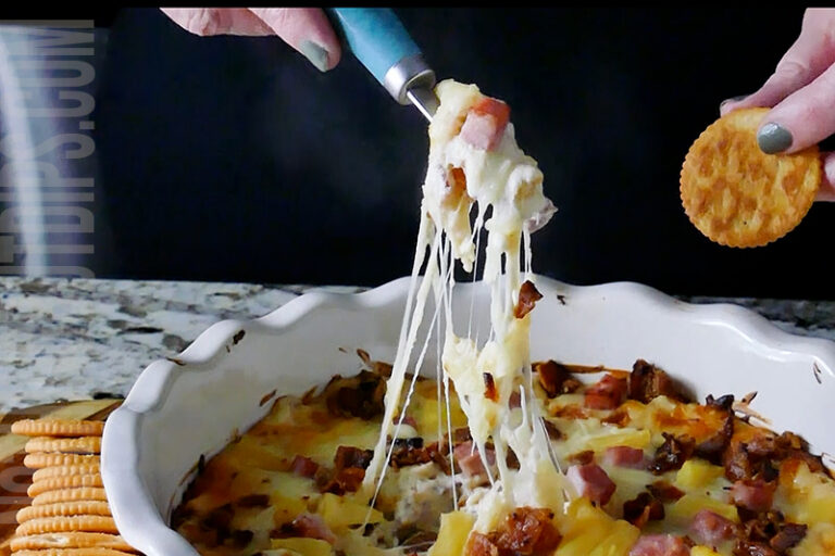 Hawaiian Pizza Dip being served on a cracker