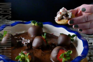 sweet and creamy chocolate covered strawberries dip served on a shortbread cookie