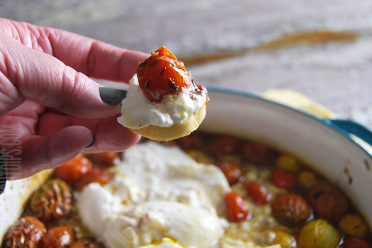 roasted tomato and burrata dip served on a cracker