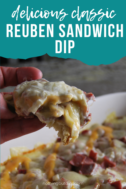 Reuben dip being served on rye bread with melty pulled swiss cheese