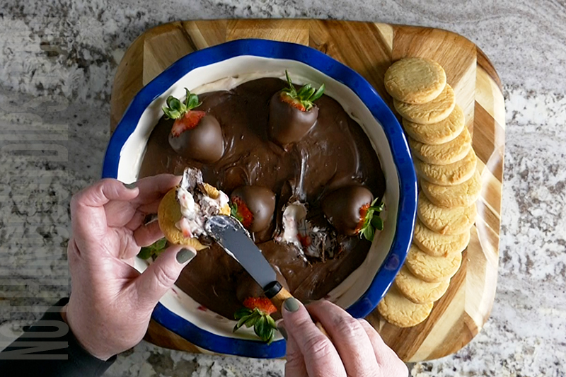 sweet and creamy chocolate covered strawberries dip served on a shortbread cookie