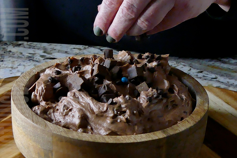 garnish the brownie bites dip with mini chocolate chips and bits of brownie