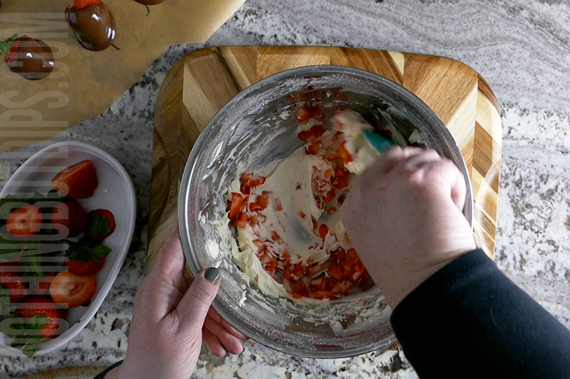 Mixed minced strawberries into the creamy base for chocolate covered strawberries dip