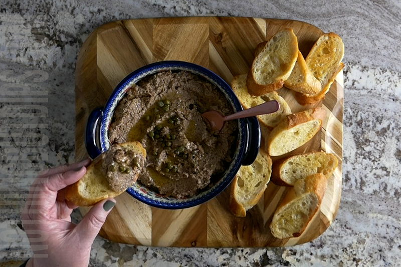 Tuscan olive puree dip served on garlic bread toastie