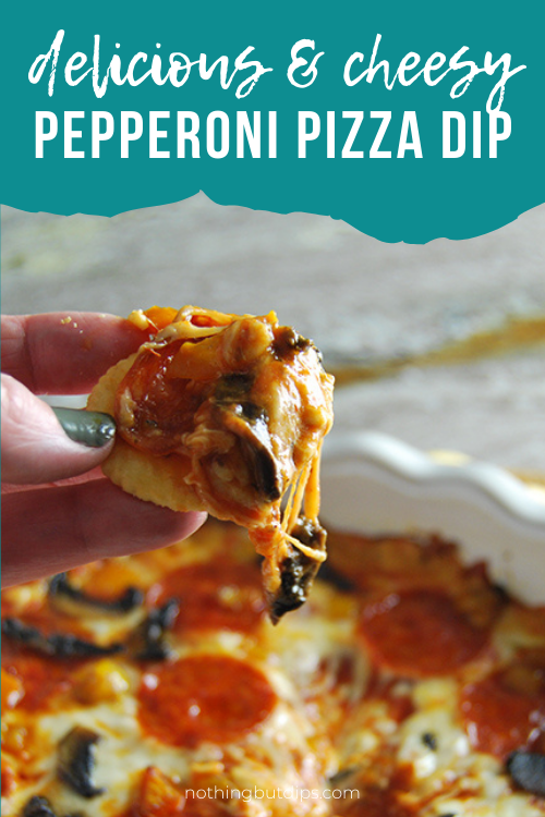 Cheesy pepperoni pizza dip served with crackers