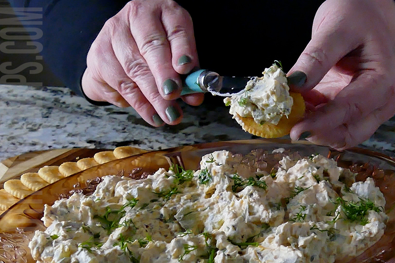 bacon cheddar pickle dip served on a cracker 