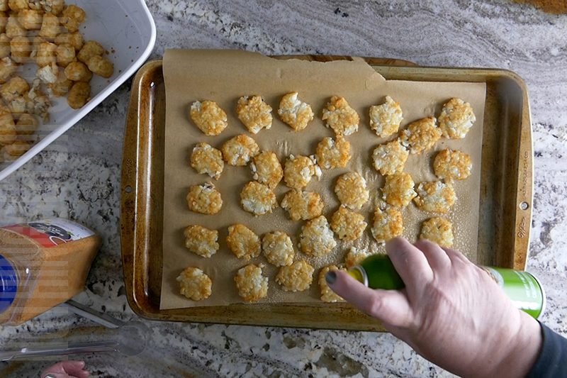coating the smashed tater tots with cooking spray