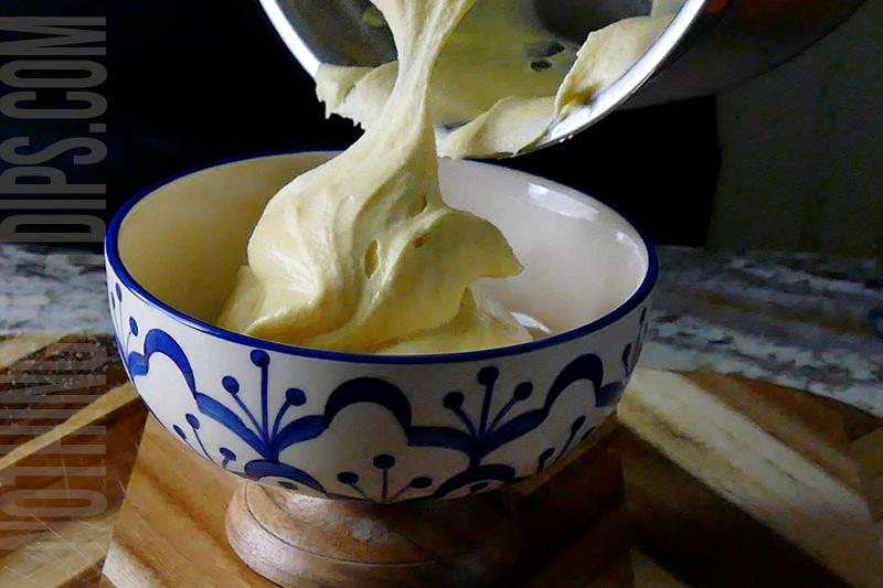 transferring the easy fruit dip to a serving dish