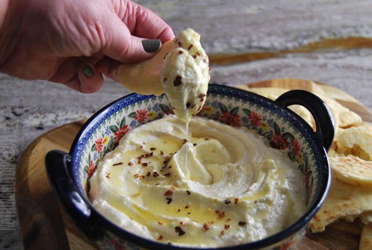 easy feta whip being served on a warm pita