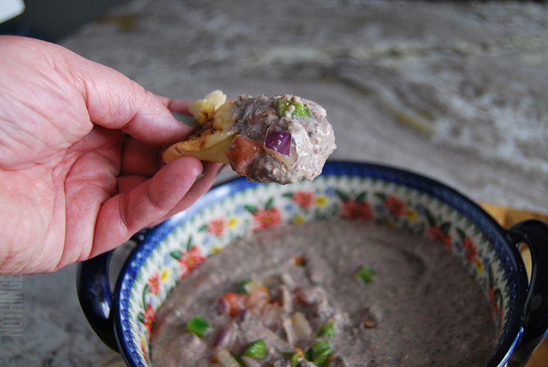 creamy black bean dip puree served on pita bread