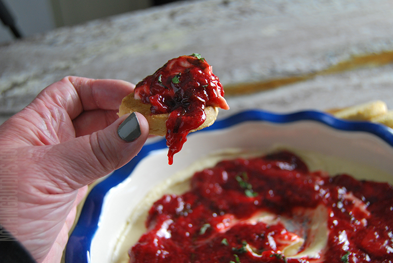 easy strawberry basil cheesecake dip served on a shortbread cookie