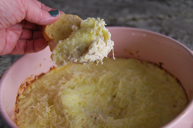 Easy potluck dish parmesan garlic wing dip served on garlic bread toast