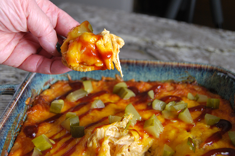 Cheesy BBQ Chicken Dip served on a cracker