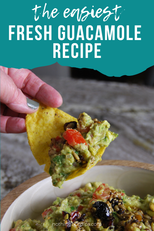 Homemade Guacamole served on a tortilla chip