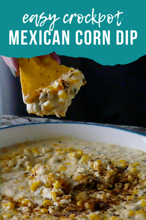 easy Mexican corn crockpot dip being served on a tortilla chip