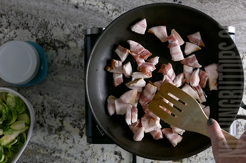 cooking bacon in a pan