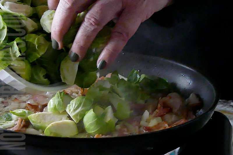 adding brussels sprouts to the pan