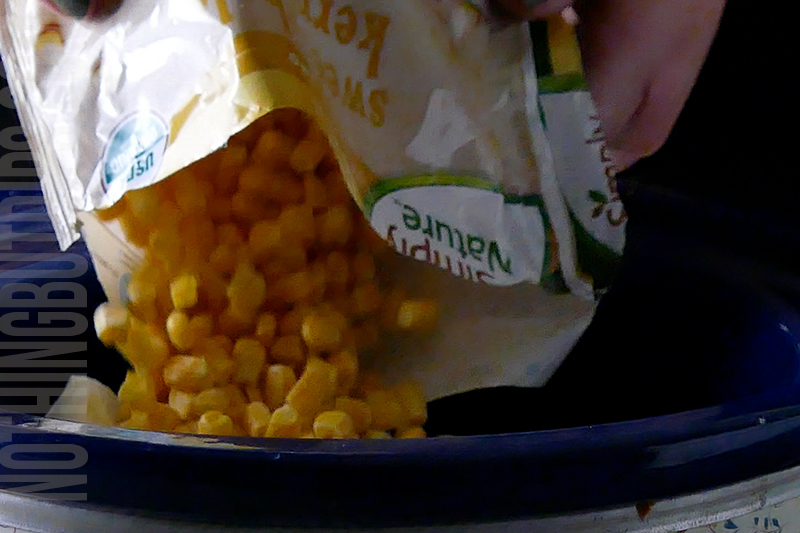 add the corn to the crockpot for the Mexican corn crockpot dip