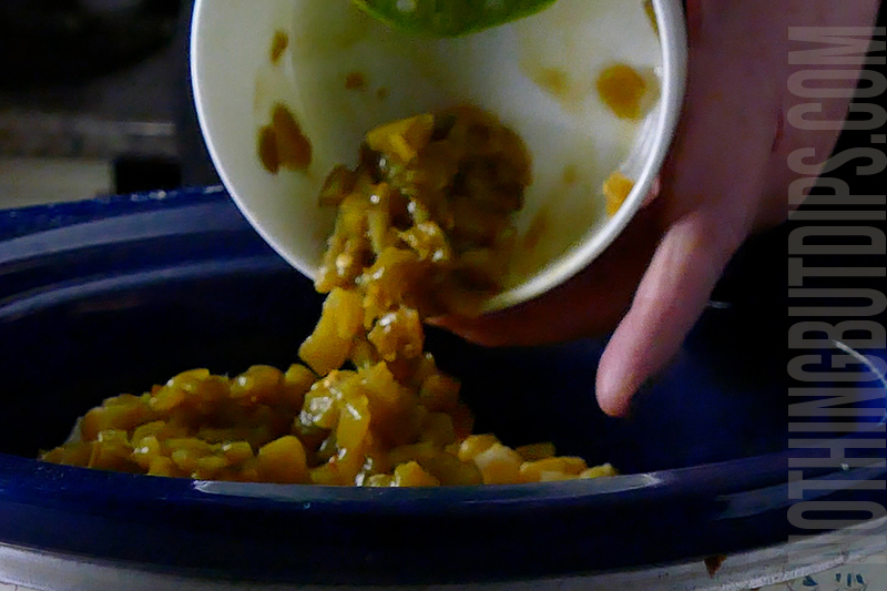 add the chilis to the crockpot for the Mexican corn crockpot dip