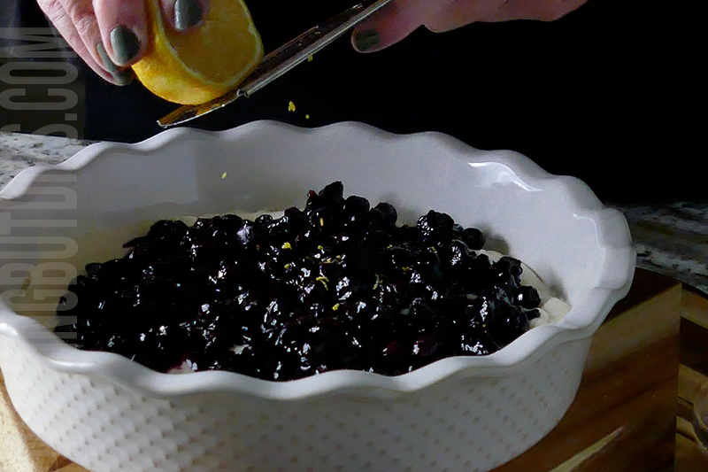 adding lemon zest as a garnish to the blueberry and lemon dip