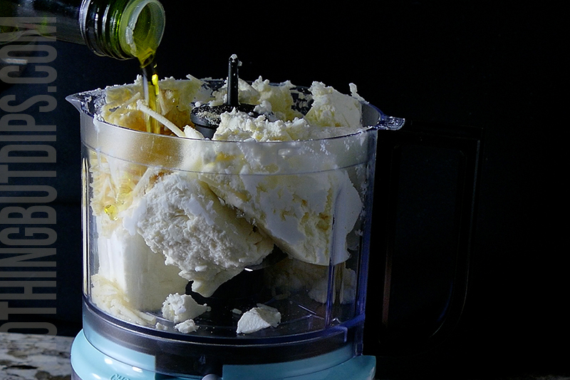 drizzling olive oil to the mini food processor to create feta whip