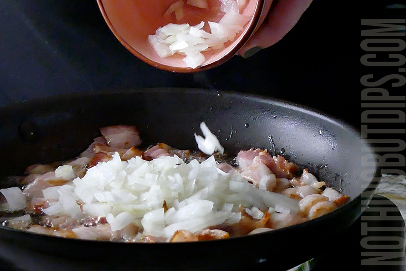 adding onions to the pan