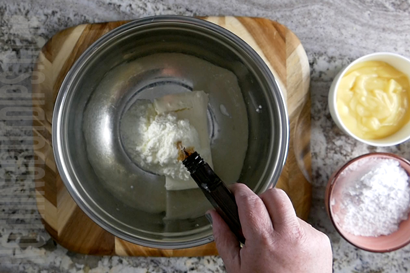 adding the vanilla to the bowl for key lime pie dip