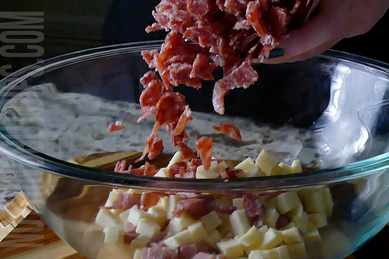 adding the diced salami to the bowl for making Italian sub dip