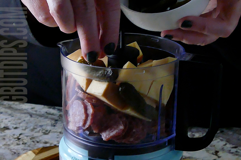 adding Gherkins to the mini food processor