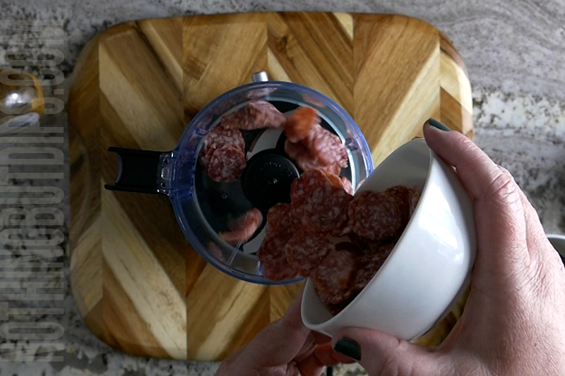 adding salami to the mini food processor