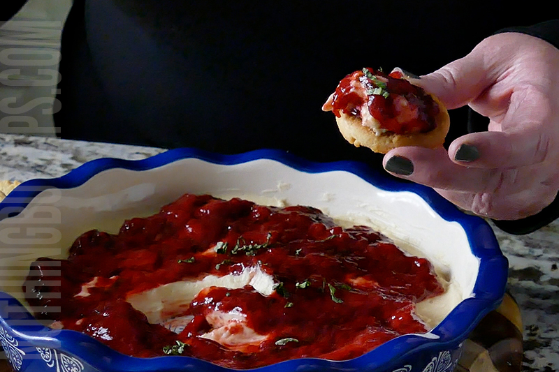 easy strawberry basil cheesecake dip served on a shortbread cookie