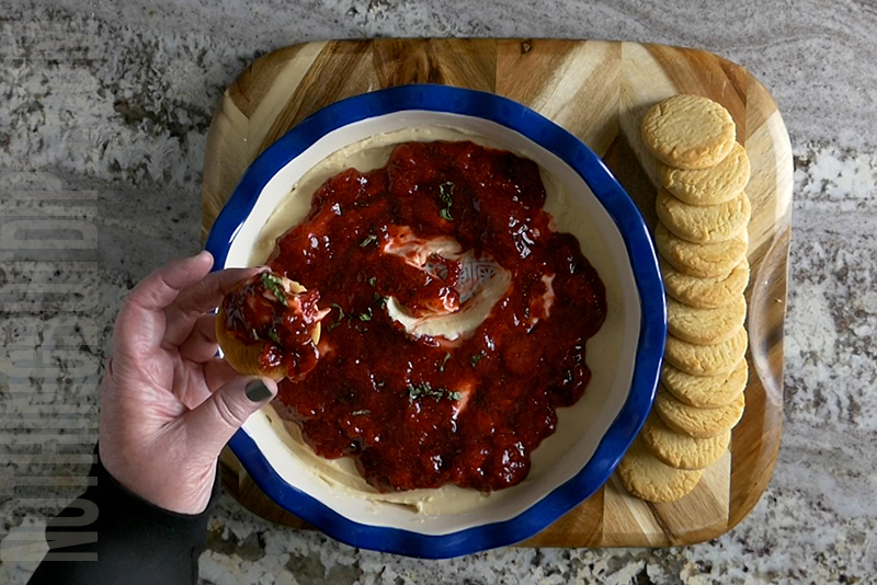 easy strawberry basil cheesecake dip served on a shortbread cookie