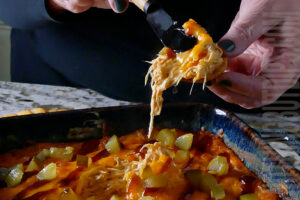 Cheesy BBQ Chicken Dip served on a cracker