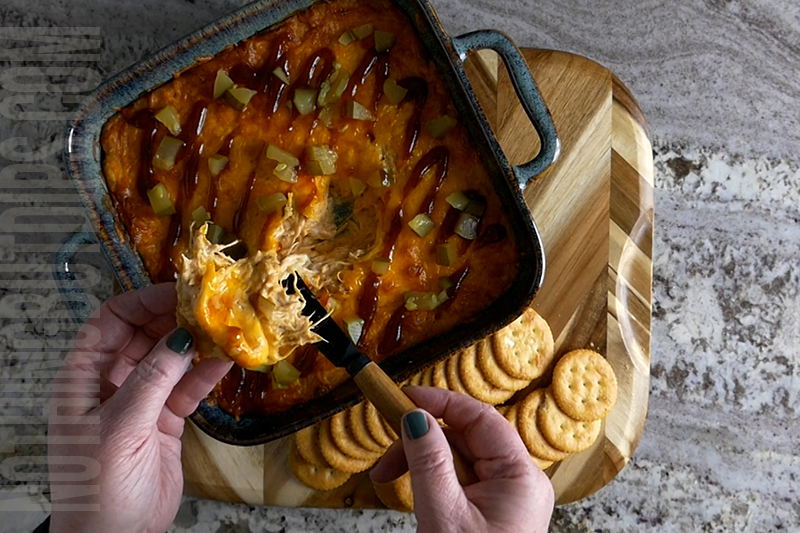 Cheesy BBQ Chicken Dip served on a cracker