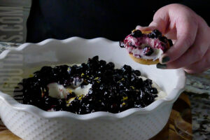 creamy blueberry and lemon dip being served on a shortbread cookie