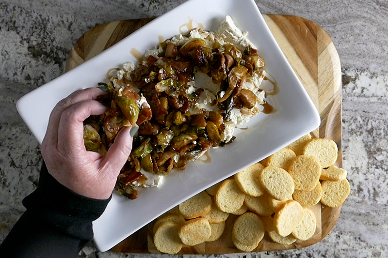 Boursin with brussels and bacon dip served on a toast crisp
