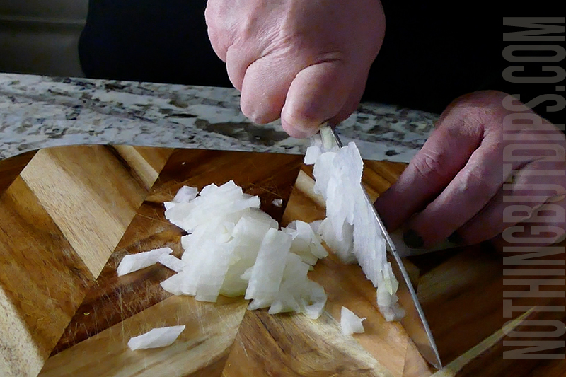 chopping onions for Boursin with brussels and bacon dip