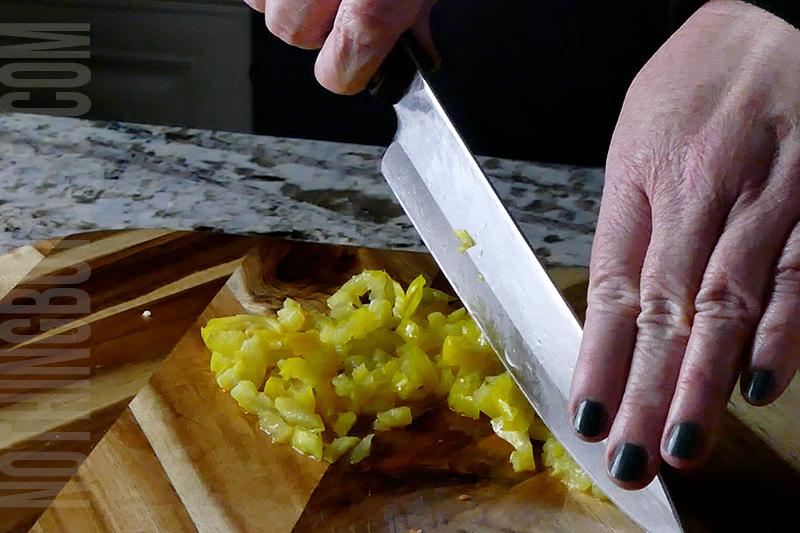 dicing the banana peppers for Italian sub dip