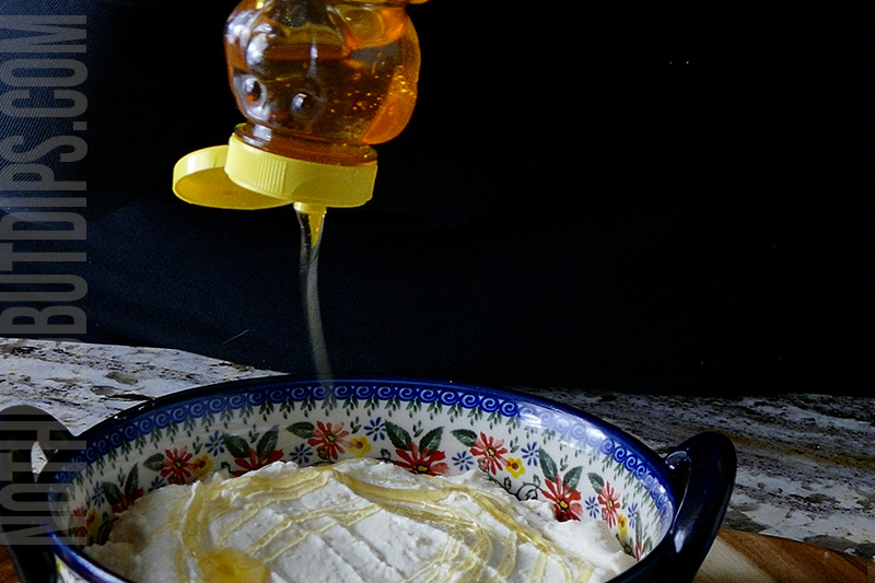 drizzling honey onto the feta whip