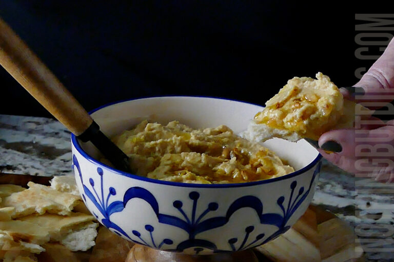 Easy homemade lemon garlic hummus dip served on warm pita bread