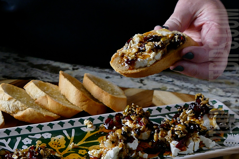 easy and delicious marinated goat cheese dip served on a garlic toastie