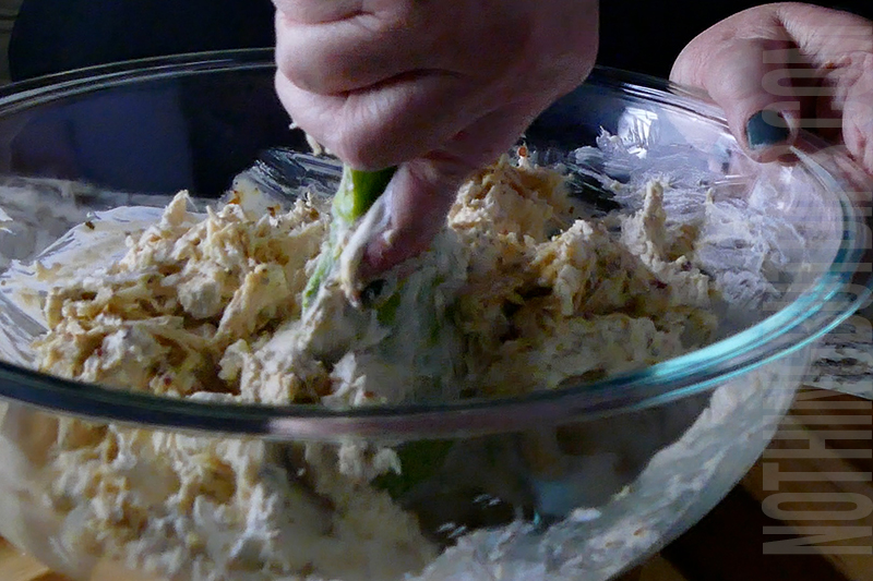 mixing the ingredients to make parmesan garlic wing dip