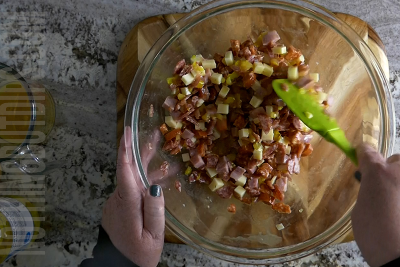 mixing all of the ingredients for the Italian sub dip