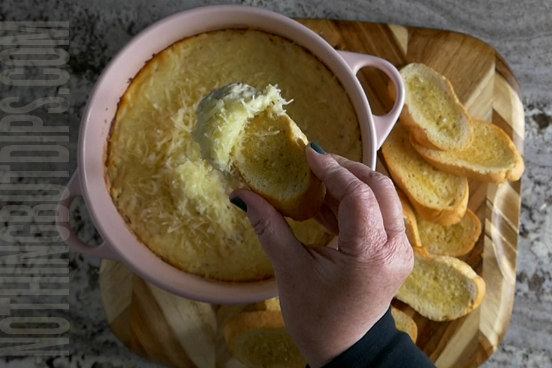Easy potluck dish parmesan garlic wing dip served on garlic bread toast