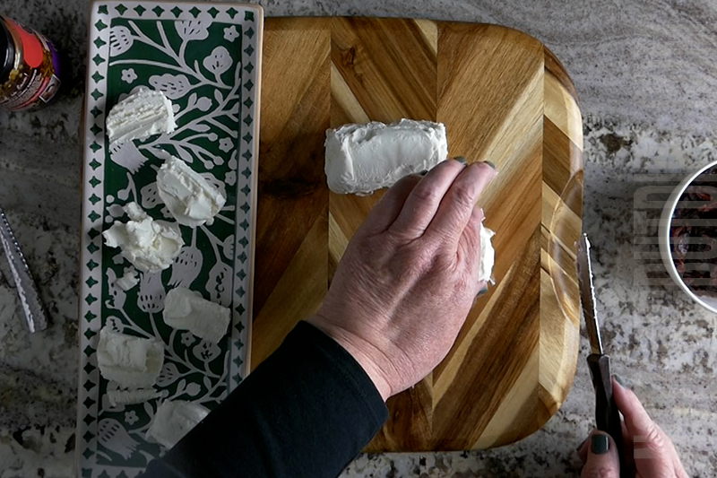 placing the goat cheese medallions on a tray