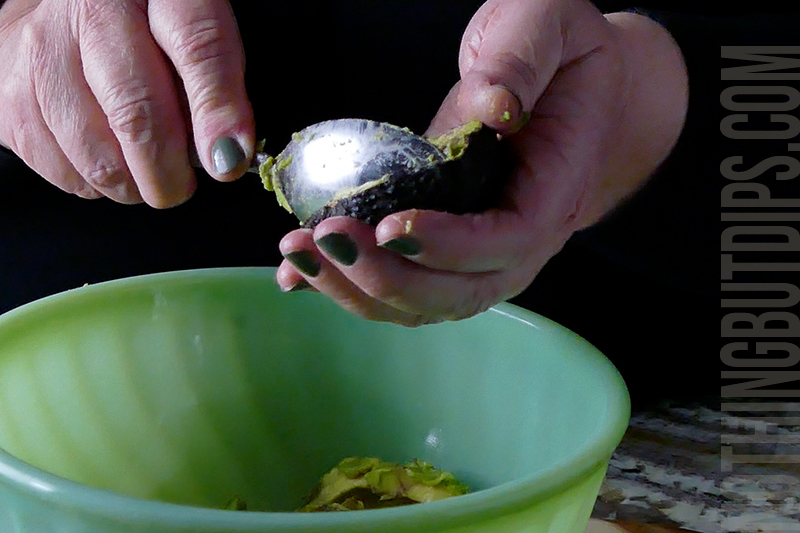 scooping avocados