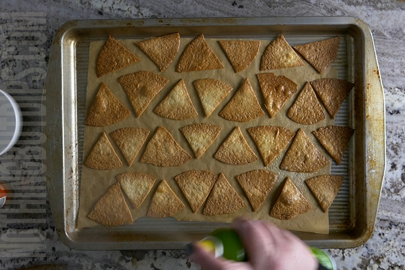 spray cooking spray onto the baked tortilla chips