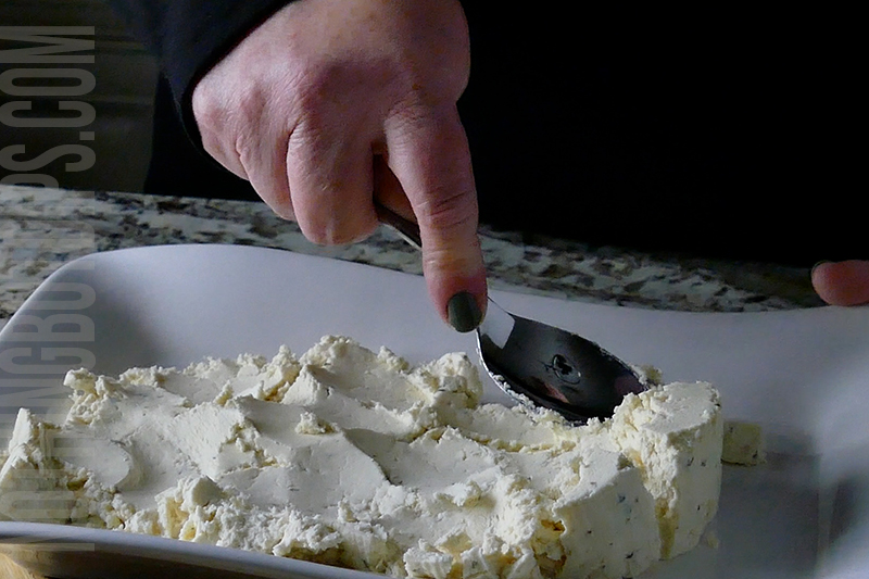 spreading Boursin on a serving tray