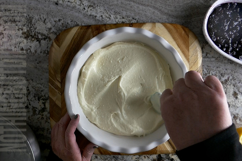 spreading the lemon cream mixture into a pie plate to form the base for our blueberry and lemon dip