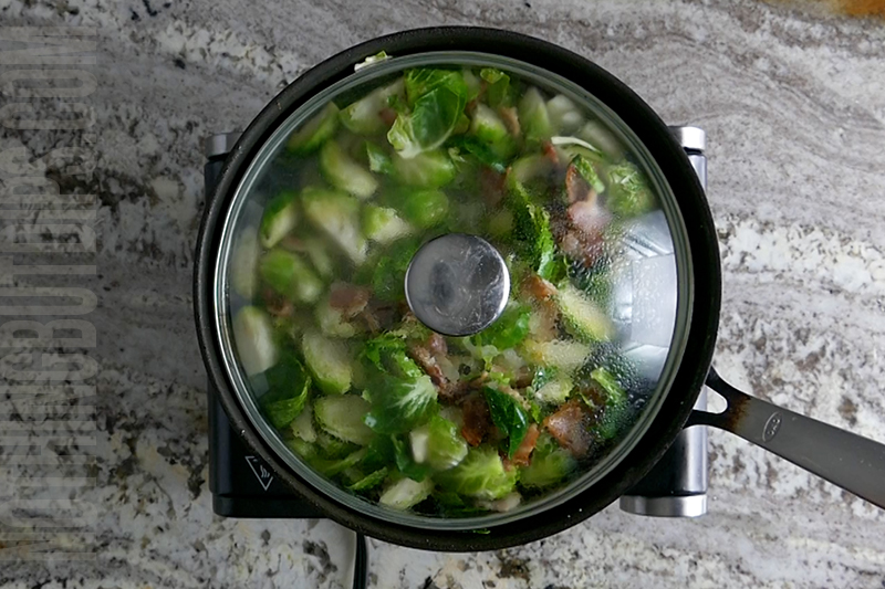 covering the brussels sprouts, bacon and onions so that the brussels steam